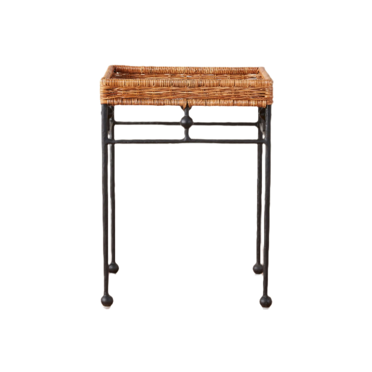 Front view of Lacoste side table with woven rattan tray top and wrought-iron legs with ball feet on white background