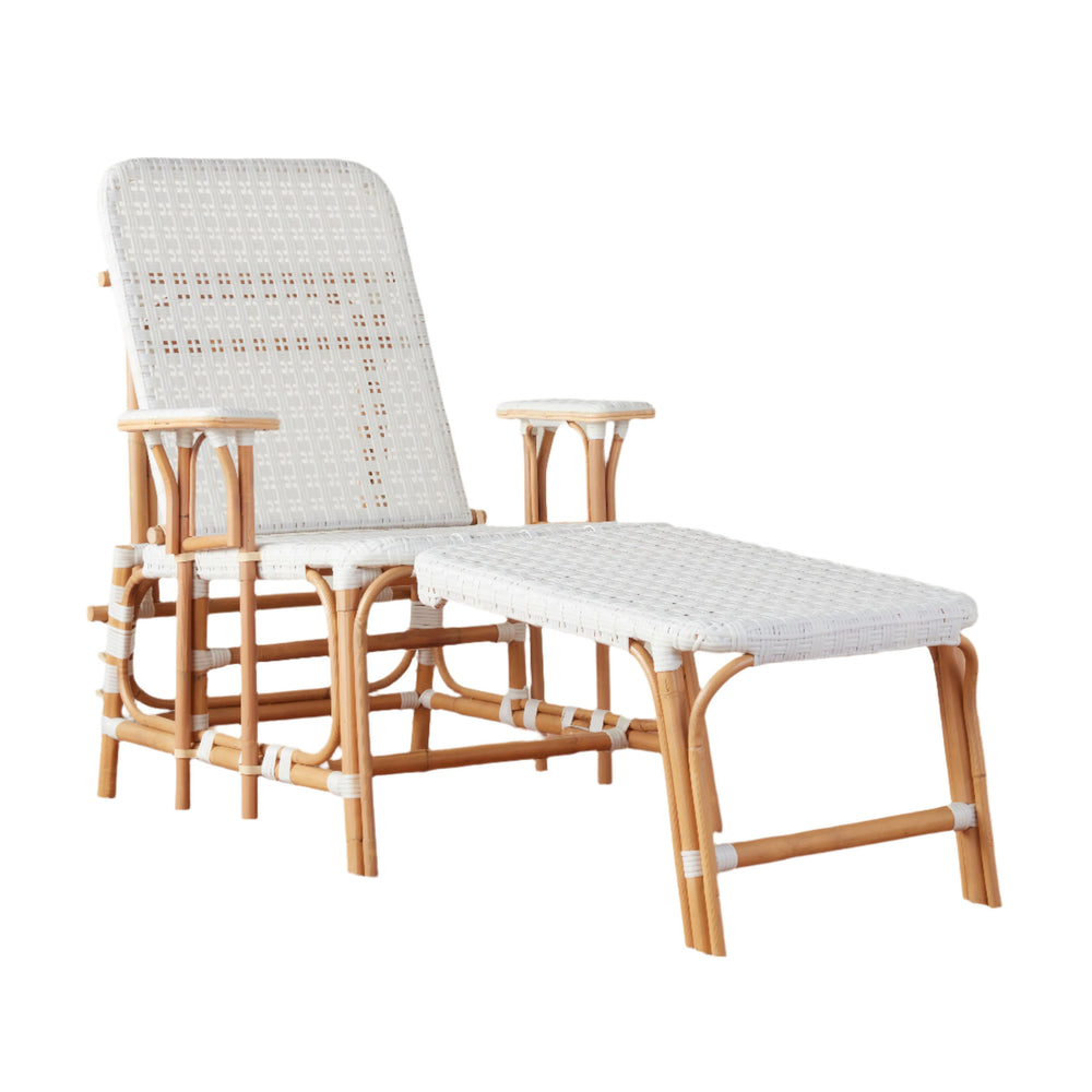 Three-quarter view of Flore Outdoor Chaise Lounge showing white woven seat and natural rattan frame with matching ottoman on white background