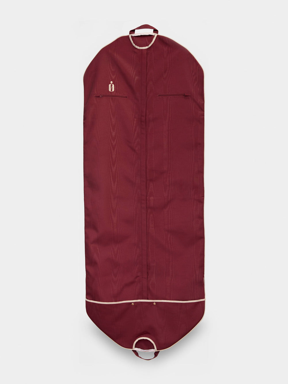 Front view of Classic Bag in Cabernet with ivory piping, two zip pockets, top hanger and bottom handle on light gray