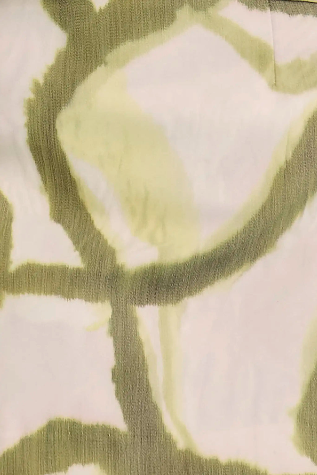 Close up of the Britt Mini Skirt in Seabreeze Ikat Green. 