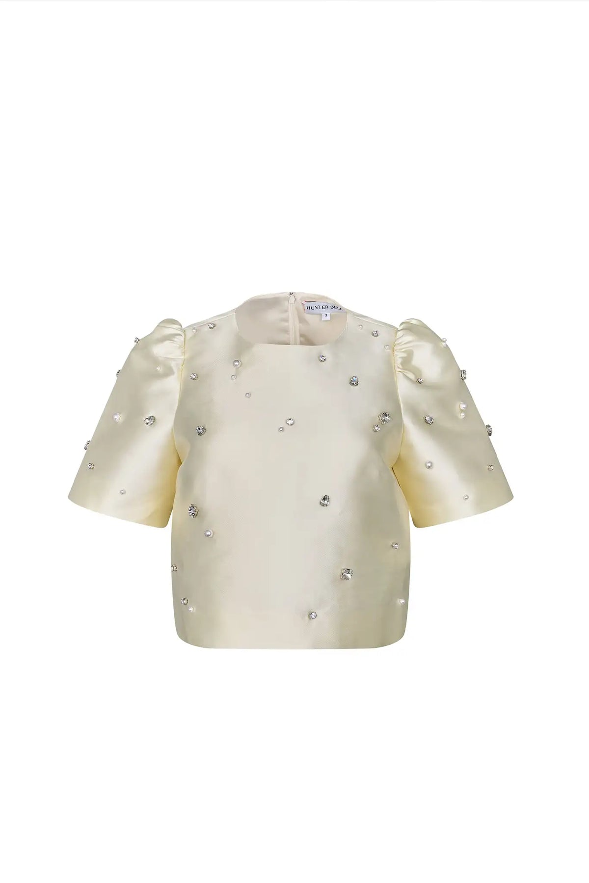 The Olivia Top is our duchess satin short-sleeve with hand-embroidered pearl-and-rhinestone detail