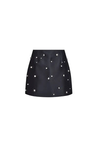 The Britt Skirt is a duchess satin black mini, hand embroidered with pearl and rhinestone detailing.