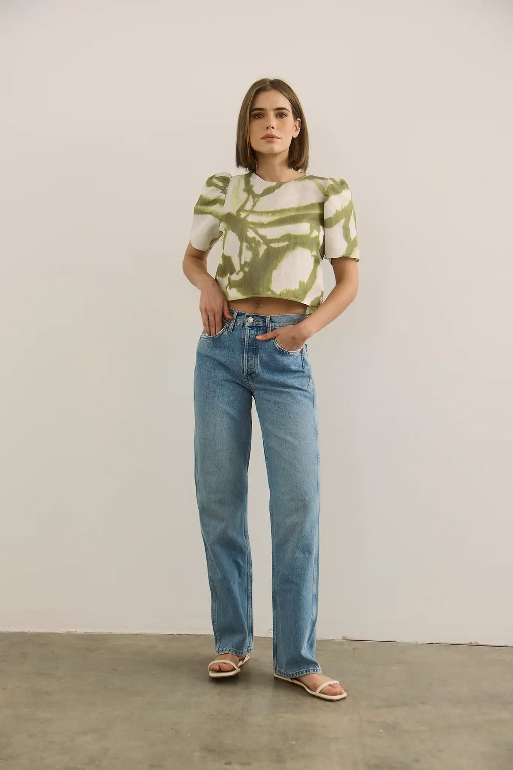 The Olivia Top in Seabreeze Ikat Green with denim.
