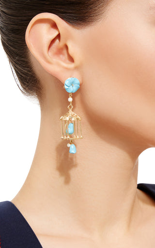 Side view of Pagoda earring in turquoise showing gold birdcage drop with turquoise and white agate on model
