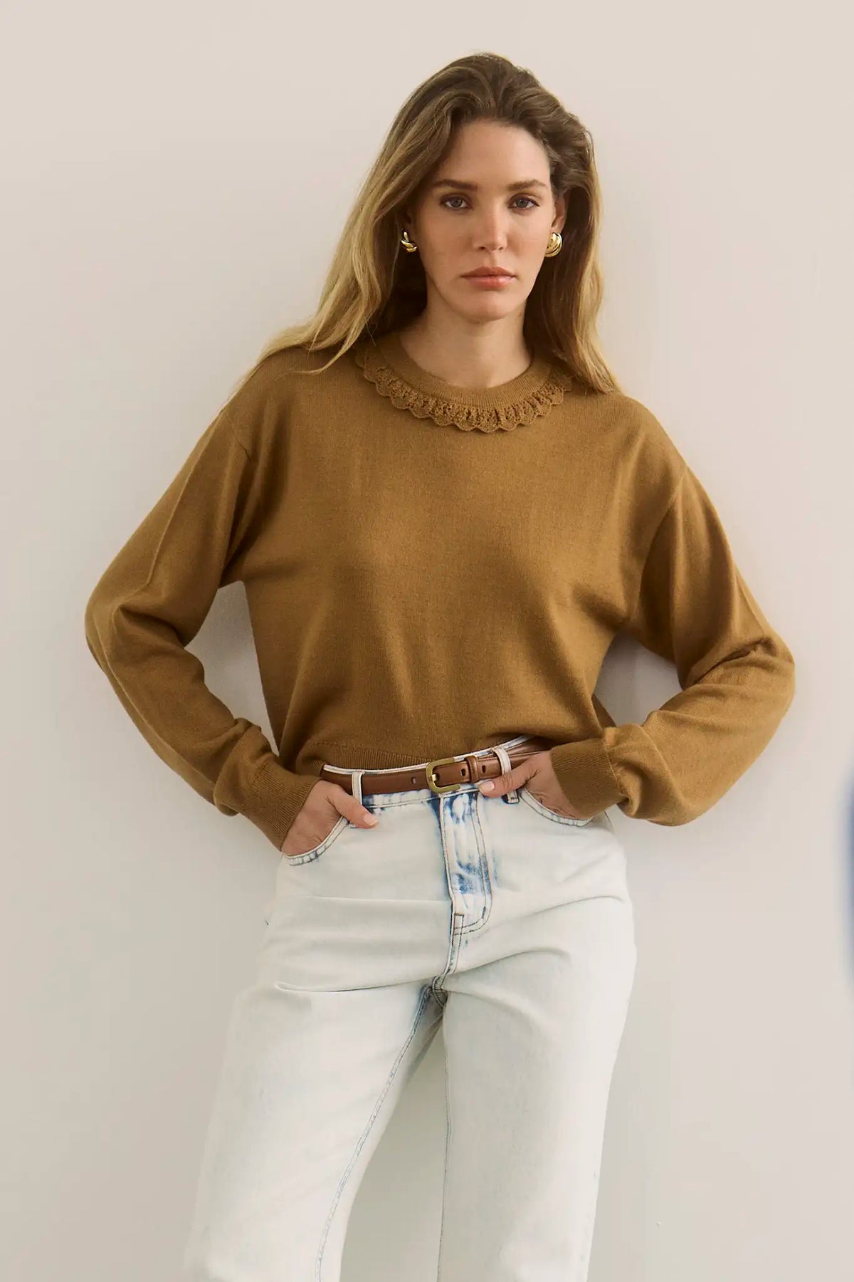 The Opal Sweater in Chestnut paired with the Wray Pant in washed blue denim. 