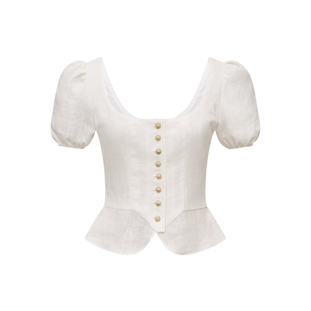 Front view of Ottilie Bodice in ivory showcasing scoop neckline, puff sleeves, brass button front and peplum hem on white background