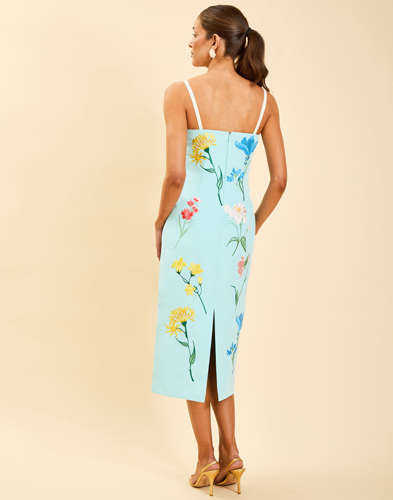 Pacifica Midi Dress in Blue Waltz moire with hand-sewn floral embroidery, peek-a-boo neckline, boned bodice, and side pockets.