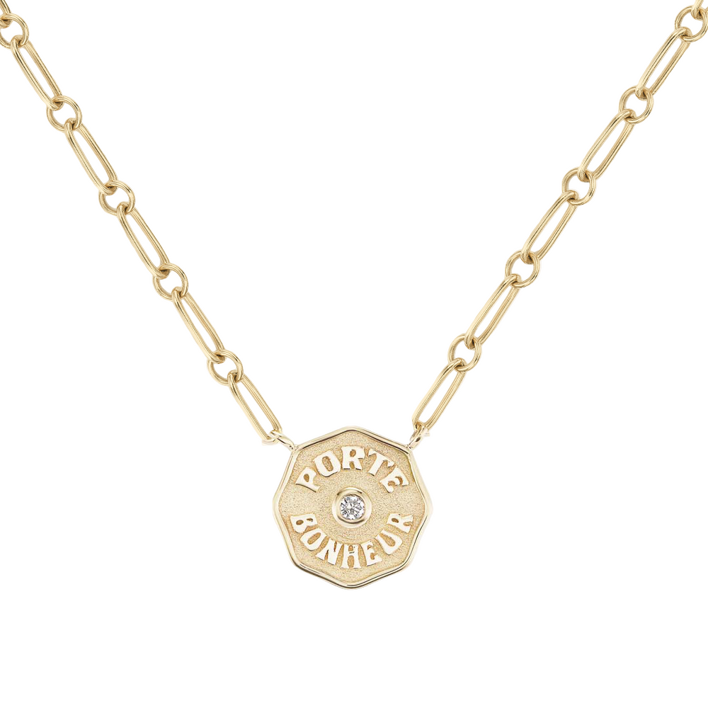 Front view of Petite PB Multi Link Necklace in 14k gold with raised ‘Porte Bonheur’ coin pendant and center white diamond