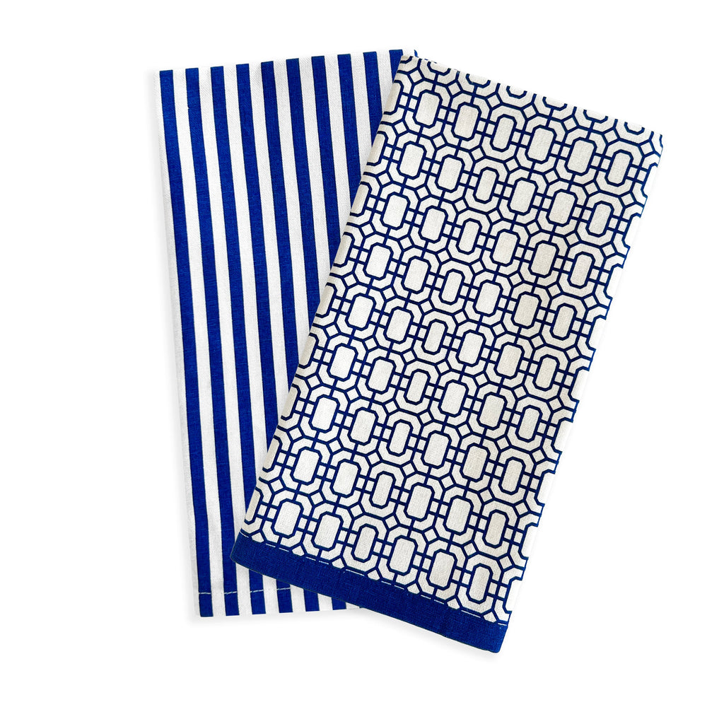Flat lay of two Newport Garden Gate and Pinstripe Blue kitchen towels showing pinstripe and geometric lattice patterns on a white background