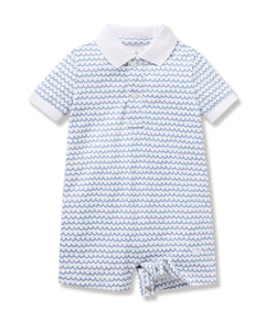 The Babys Pima Louis Play Romper in La Mer by Petite Plume is crafted from soft Pima cotton, featuring short sleeves, a shirt collar, button placket, and short legs. The fabric pattern has small wavy blue lines on white, evoking waves in a clean and crisp design.