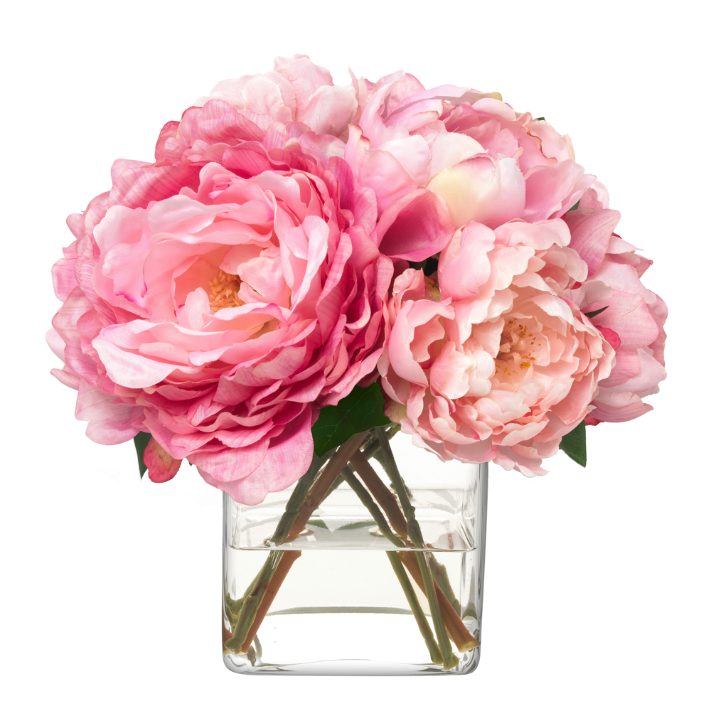 Front view of Pink Champagne faux peony bouquet in clear square vase with large pink blooms on white background