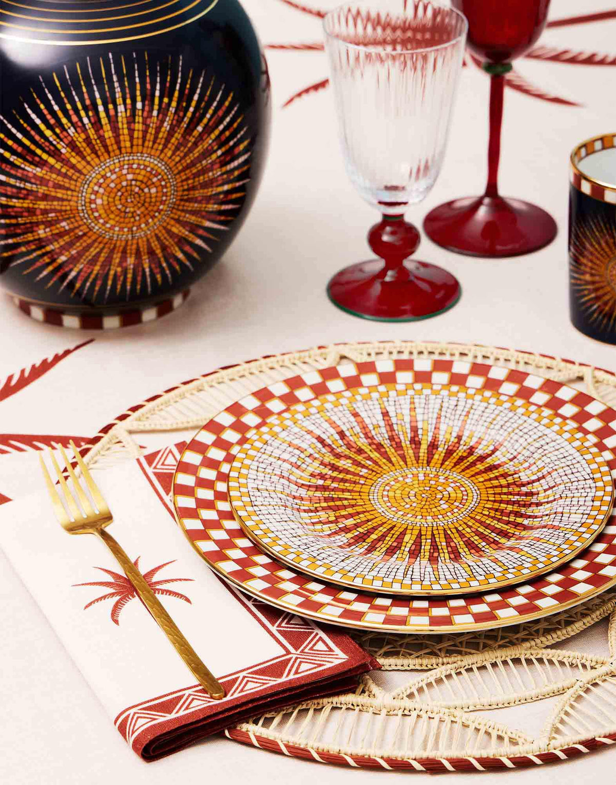 Front view of Dessert Plates in Solar Multicolor, Set of 4 showcasing multicolor radial patterns and gold trim with a styled table setting