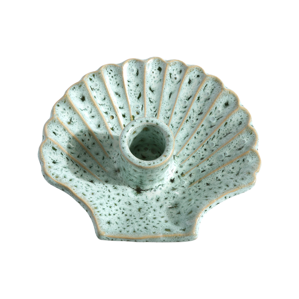 Top view of Concha shell-shaped ceramic candle holder in seafoam speckled glaze on white background