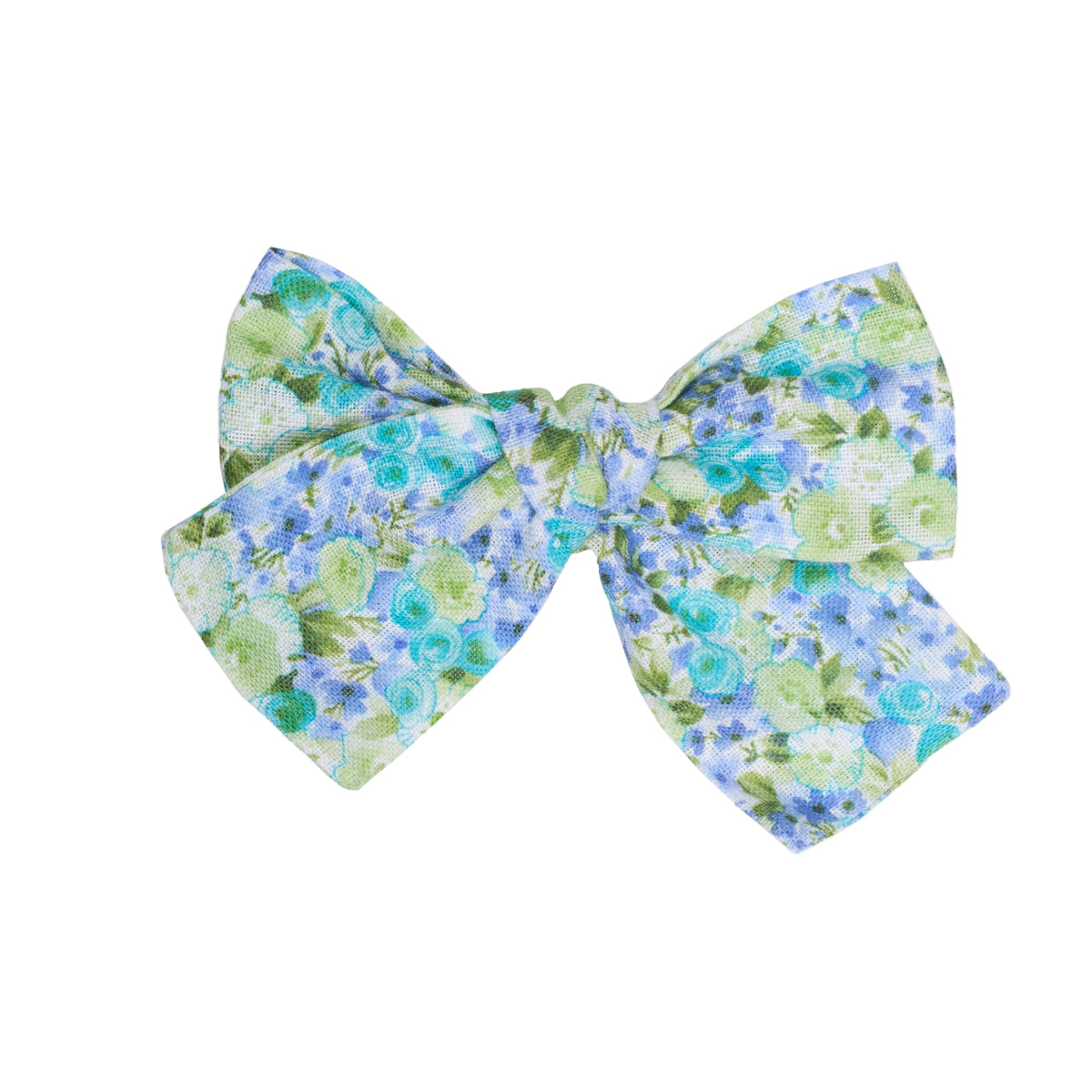 Top view of linen flower bow clip showcasing blue and green floral linen-cotton fabric and bow shape on white background