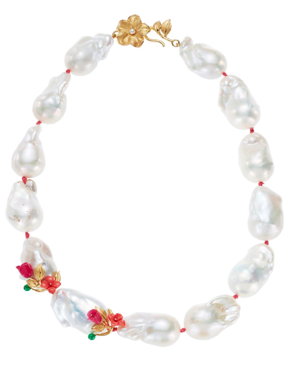 Top view of Power Pearl Necklace with large white baroque pearls, fuchsia and coral flower accents and gold clasp