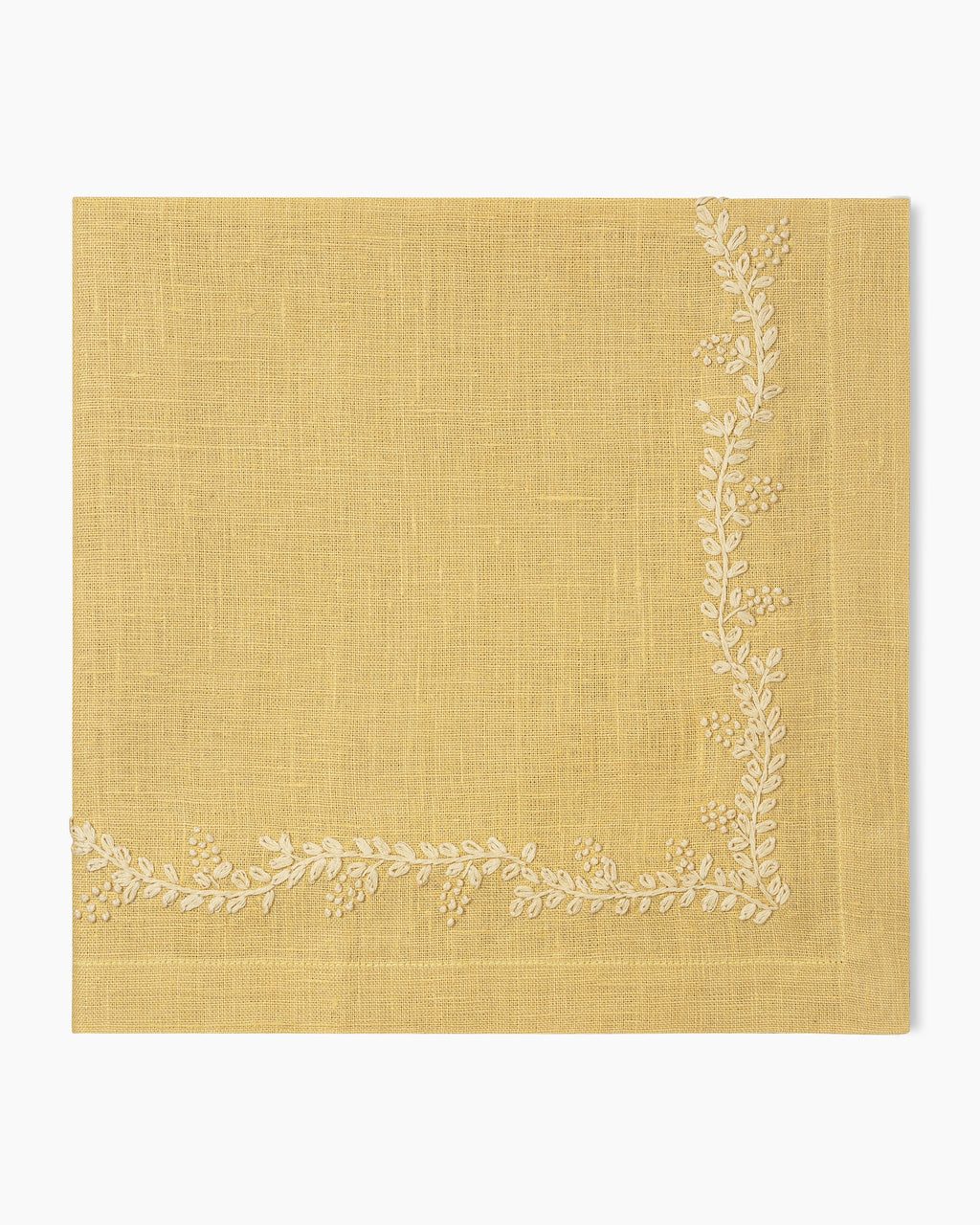A Prism Vine Linen Dinner Napkin in 13 Colors by Henry Handwork with white embroidery, perfect for table linens.