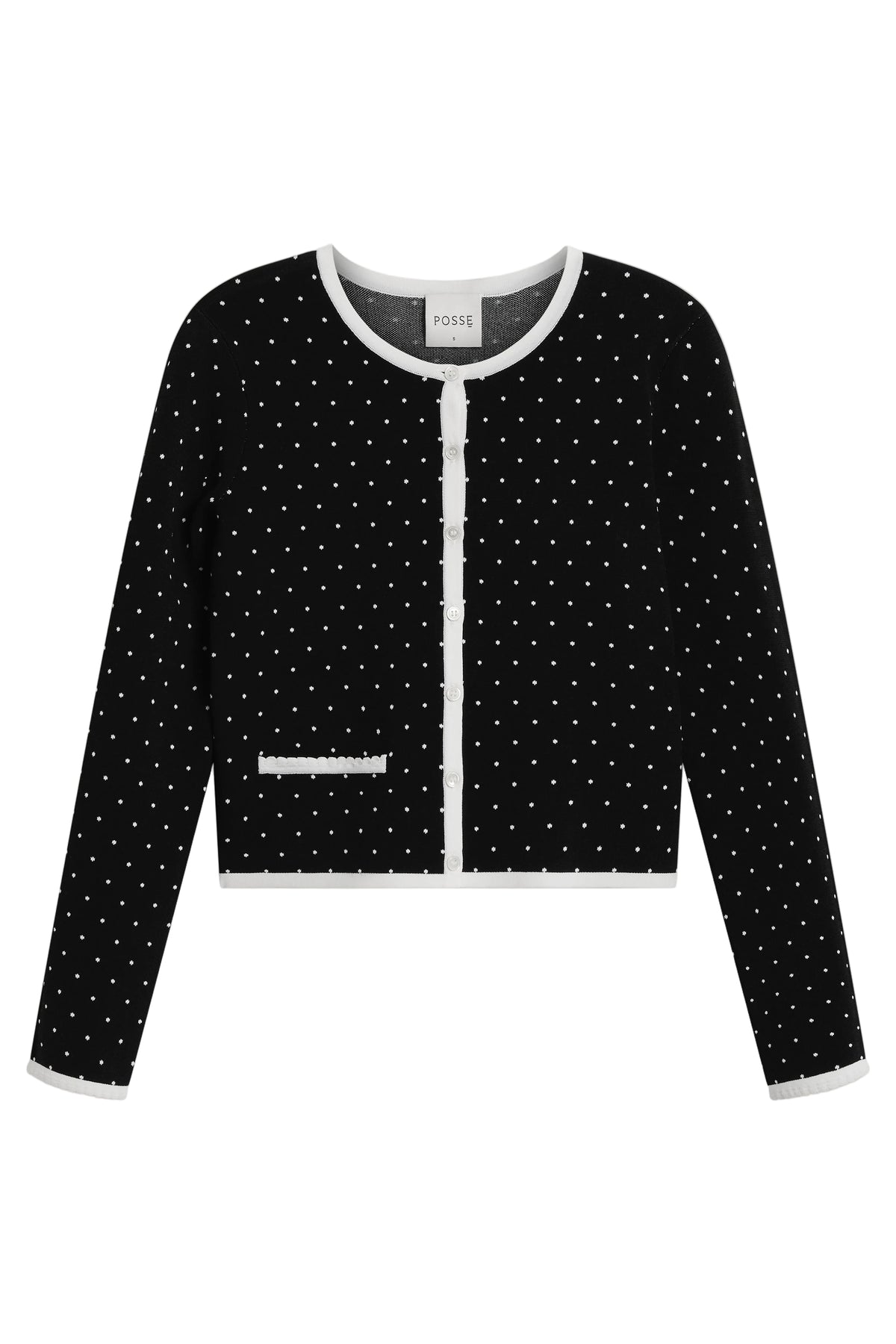 Front view of Michalla cardigan in black with white polka dots showcasing white trim and button front on a white background