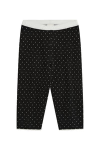 Front view of Michalla Capri in black and white polka dot showcasing the contrasting white waistband on a white background