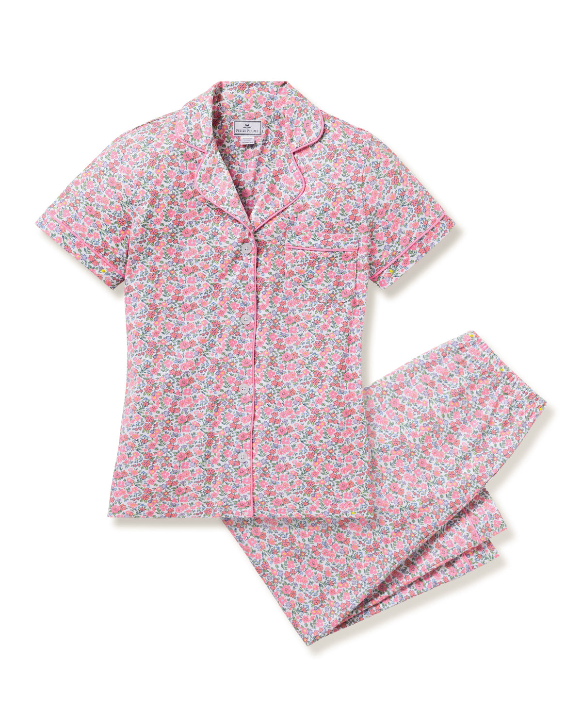 Flat lay of Women’s Pima Crop Set in Fleurs de Rose, pink floral top with notched collar and cropped pants on white