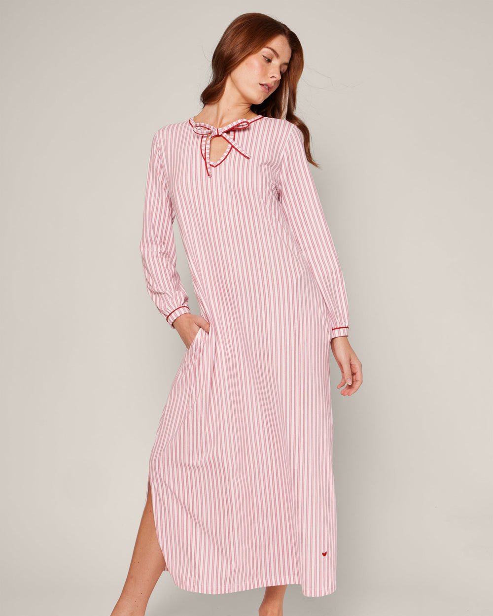 Angled view of Women’s Pima Harlow nightgown in antique red ticking stripes, long sleeves, keyhole tie neckline and side slit