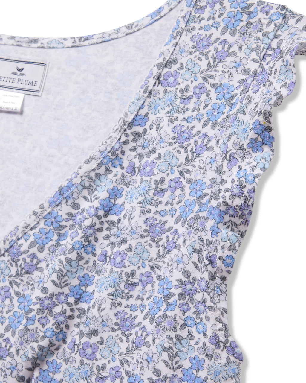 Close-up of Petite Plumes Womens Pima Harper Nightgown in Fleur dAzur, with a vintage floral design in blue and purple on a light background. The garments label is partially visible.
