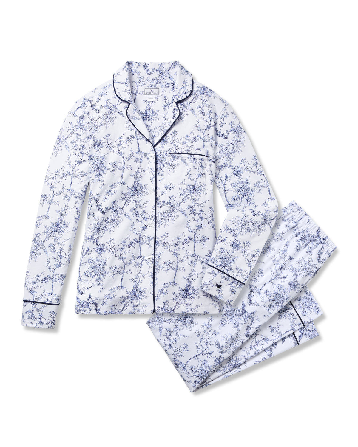 Flat lay of Womens Pima pajama set in Timeless Toile with blue floral print, navy piping, button-front top and matching pants