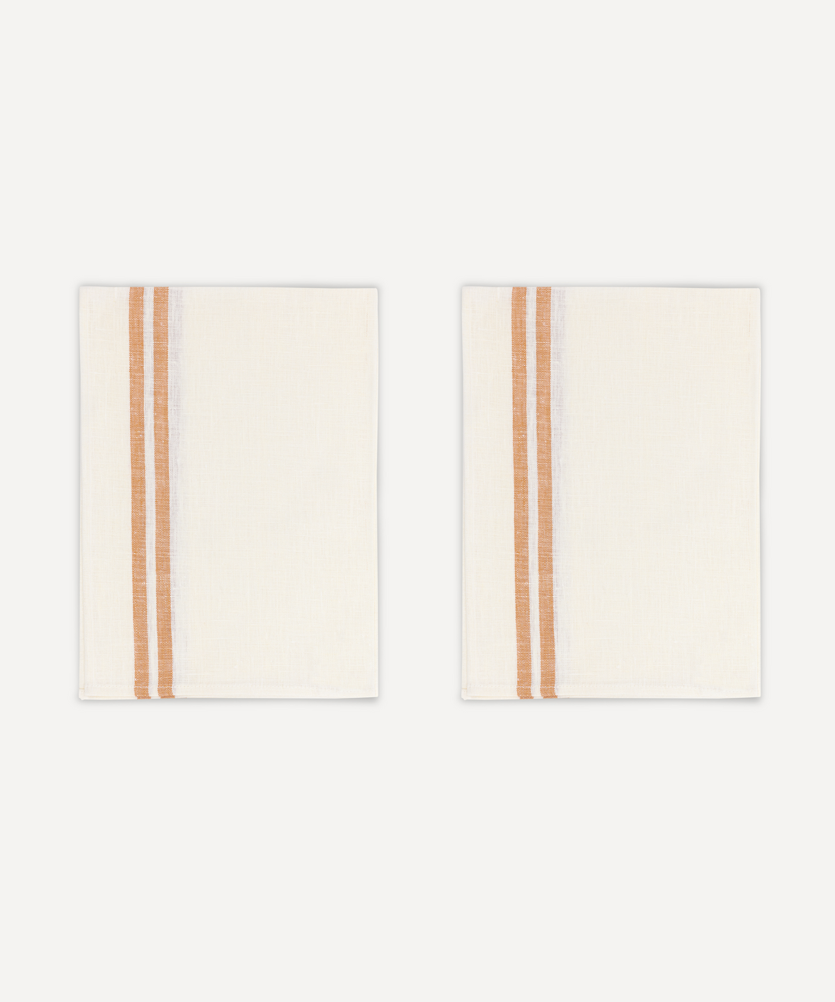 Front view of two striped linen tea towels in burnt orange and ivory, displayed side by side on a light background