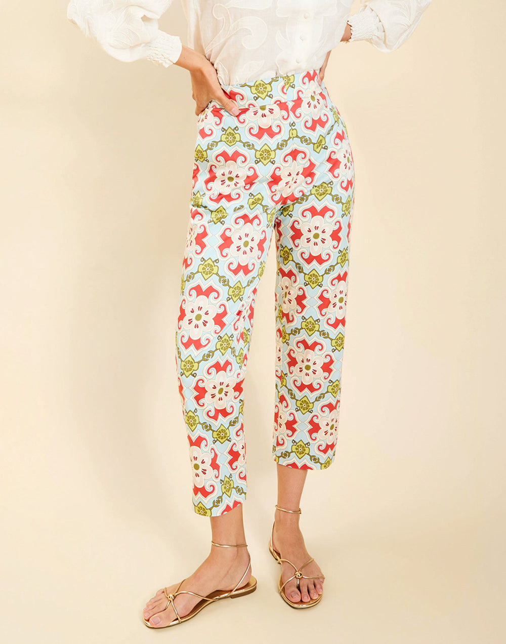 Model wearing the Palau Cigarette Pant in Quatrefoil Sierra print, featuring a slim-fit cropped silhouette, tailored front pleat detailing, side seam pockets, and crisp poplin fabrication.