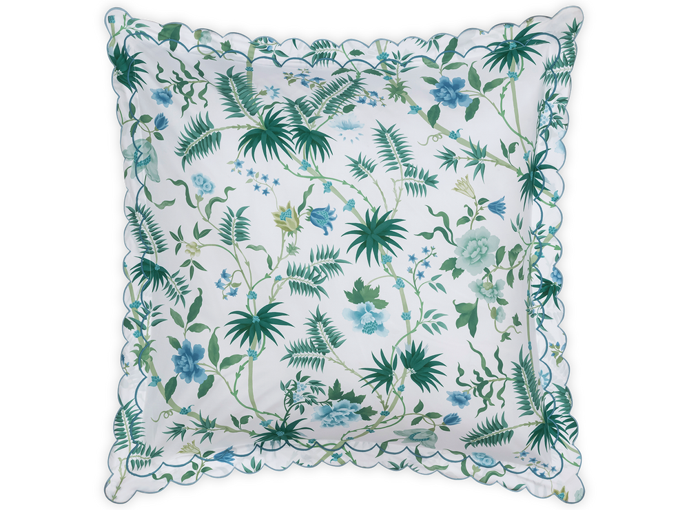 Front view of Palmyra Euro sham showing emerald palm frond and blue floral print with scalloped embroidered edge on white background