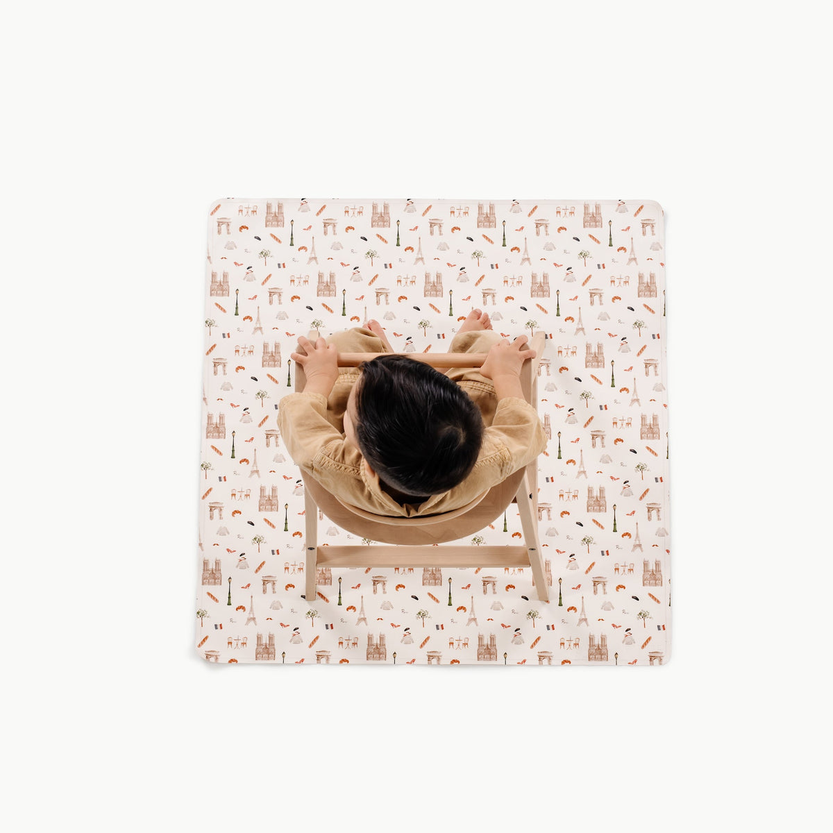 Paris@overhead of kid in a highchair on the paris mini mat