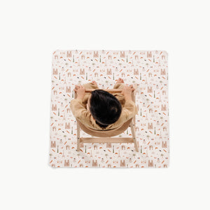 Paris@overhead of kid in a highchair on the paris mini mat