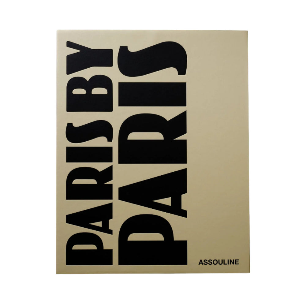 Front view of Paris by Paris hardcover coffee table book showcasing large vertical black title text on a beige cover with Assouline logo