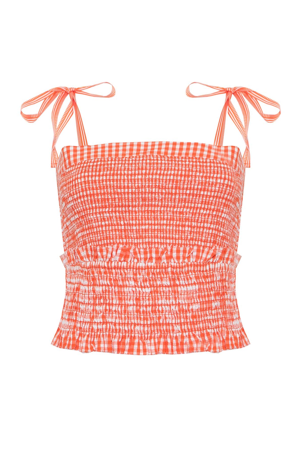 A square neck smocked top with tie shoulder straps in seersucker gingham with a ruffle hem.