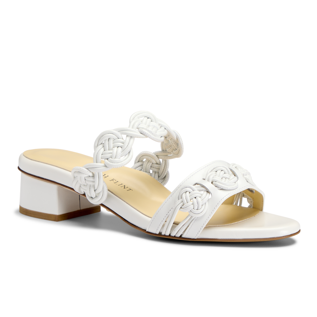 Side view of the Perfect Celeste 30 in White Calf mule showcasing handmade knot detailing and inset block heel