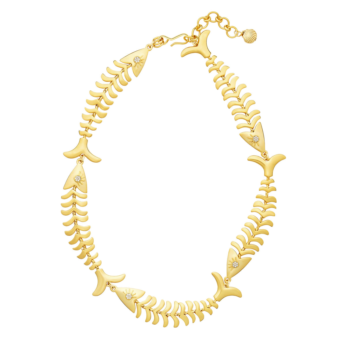 Flat lay of Pesca necklace with 24K antique gold plated articulated fish links and crystal eyes on white background