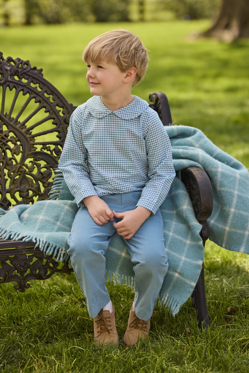Little English traditional children's clothing.  Classic long sleeve peter pan shirt in blue Alpine Gingham paired with blue Alpine Corduroy pull on pants for toddler boys