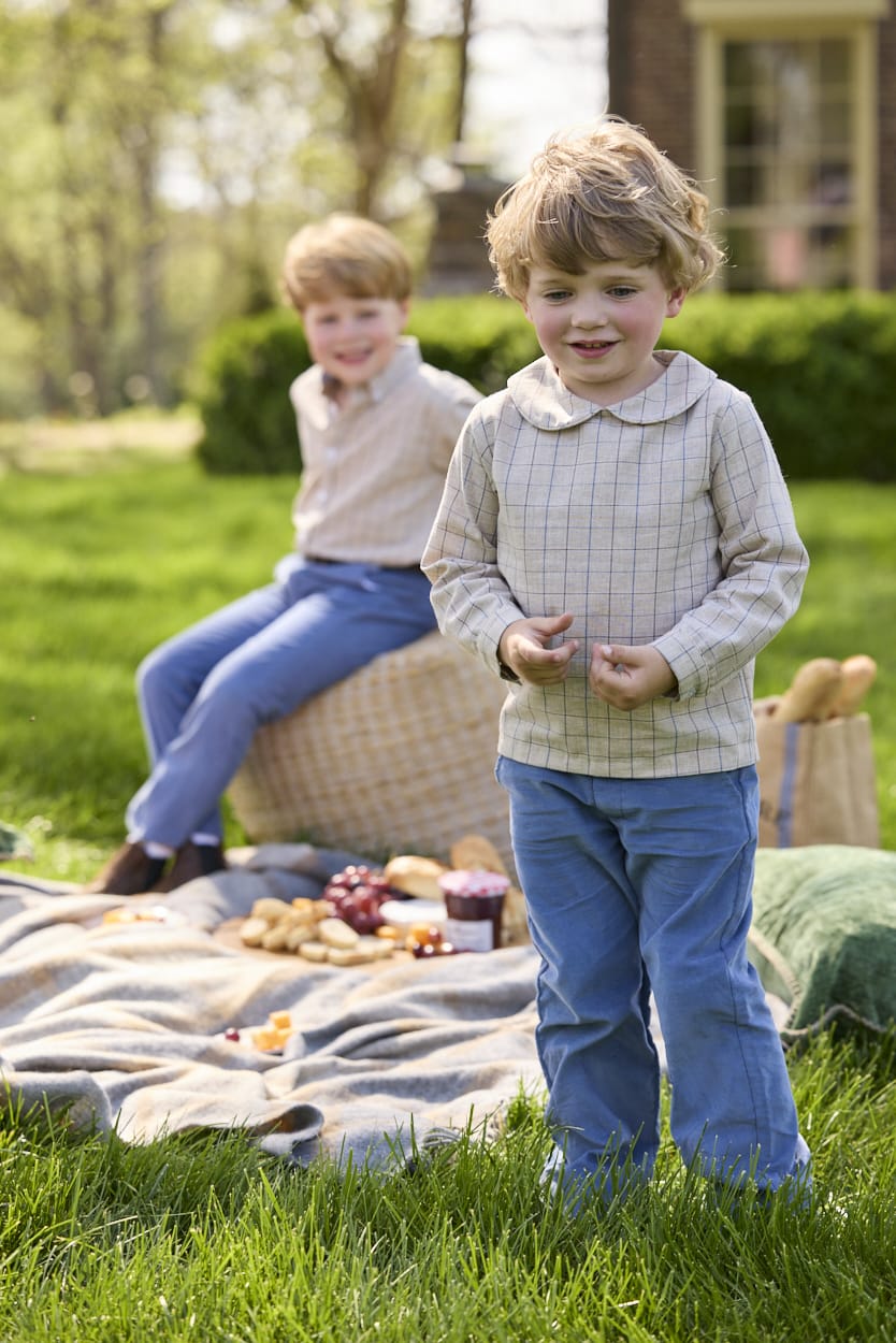 Little English traditional children's clothing.  Tan and blue Durham Windowpane peter pan shirt for toddler boys paired with stormy blue corduroy pull on pants.