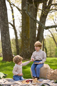 Little English traditional children's clothing.  Tan and blue Durham Windowpane peter pan shirt for toddler boys paired with stormy blue corduroy pull on pants. Older boy in stormy blue corduroy classic pants and Durham Windowpane button down shirt