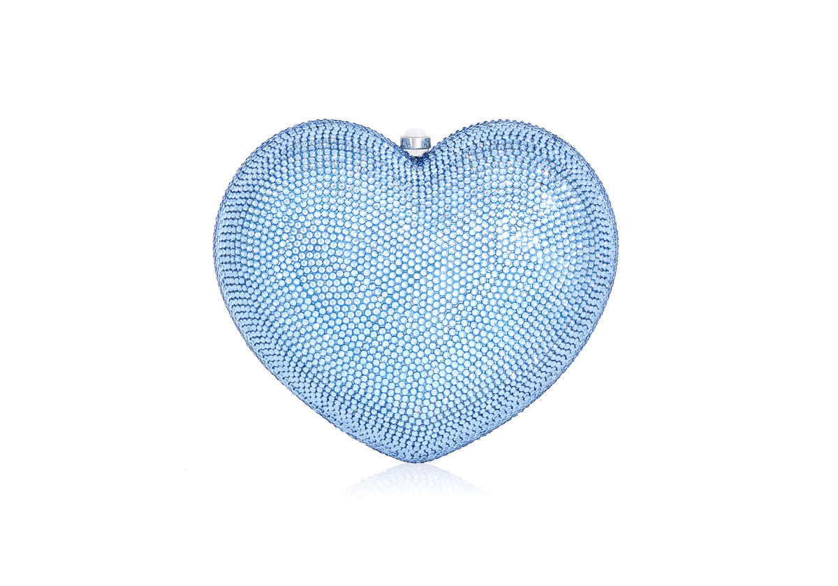 Front view of Petit Coeur L’Amour heart-shaped clutch showcasing light sapphire crystal embellishment on white background