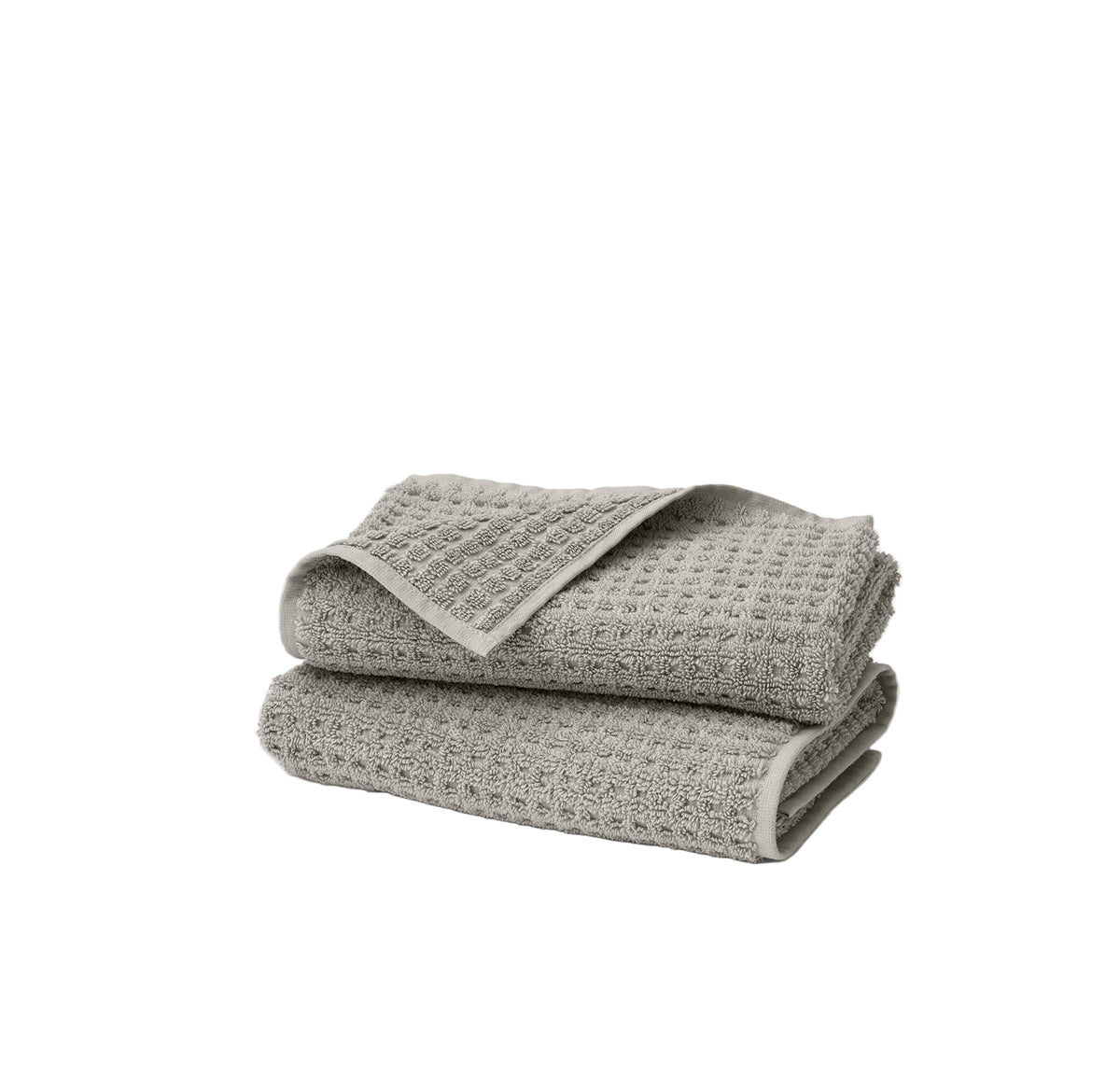 Front view of stacked Turkish waffle hand towel set of 2 in pewter showing dimensional waffle weave texture on white background