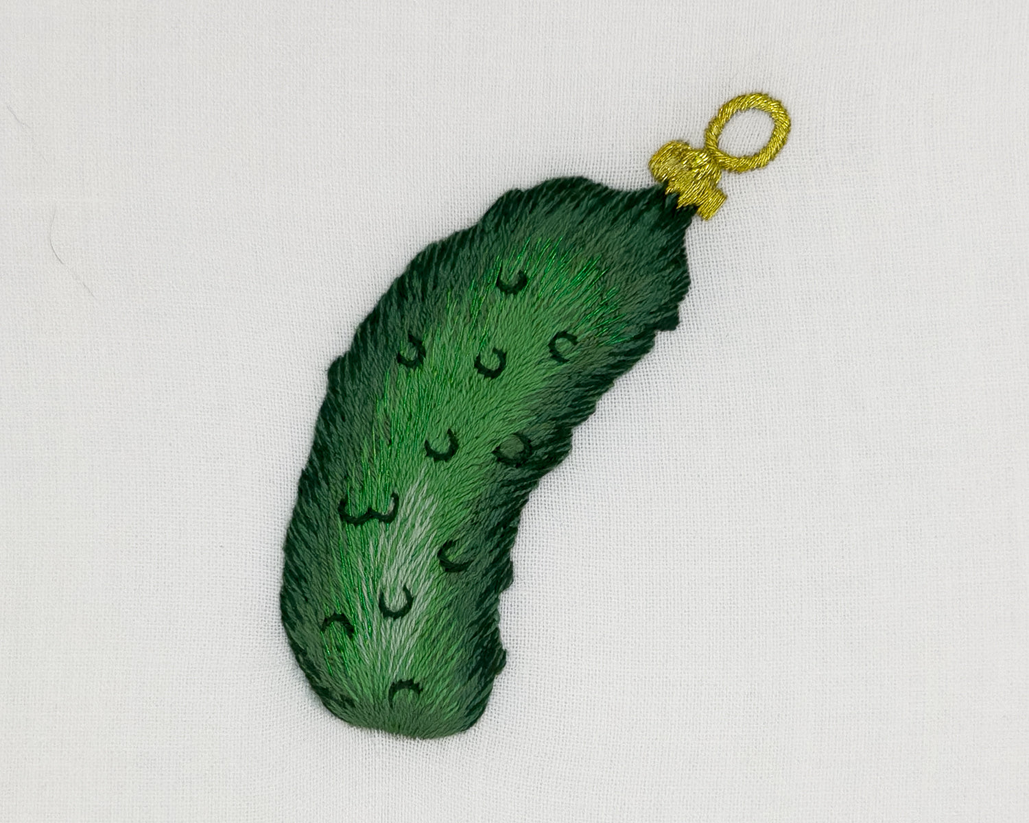 Image of a Henry Handwork Pickle Ornament motif.