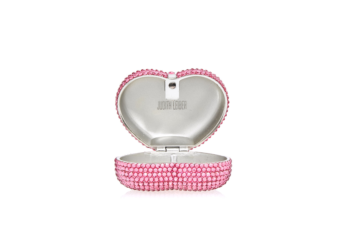 Open view of Heart Miniature Pillbox in Pink showcasing crystal-adorned brass and push-lock closure on white background