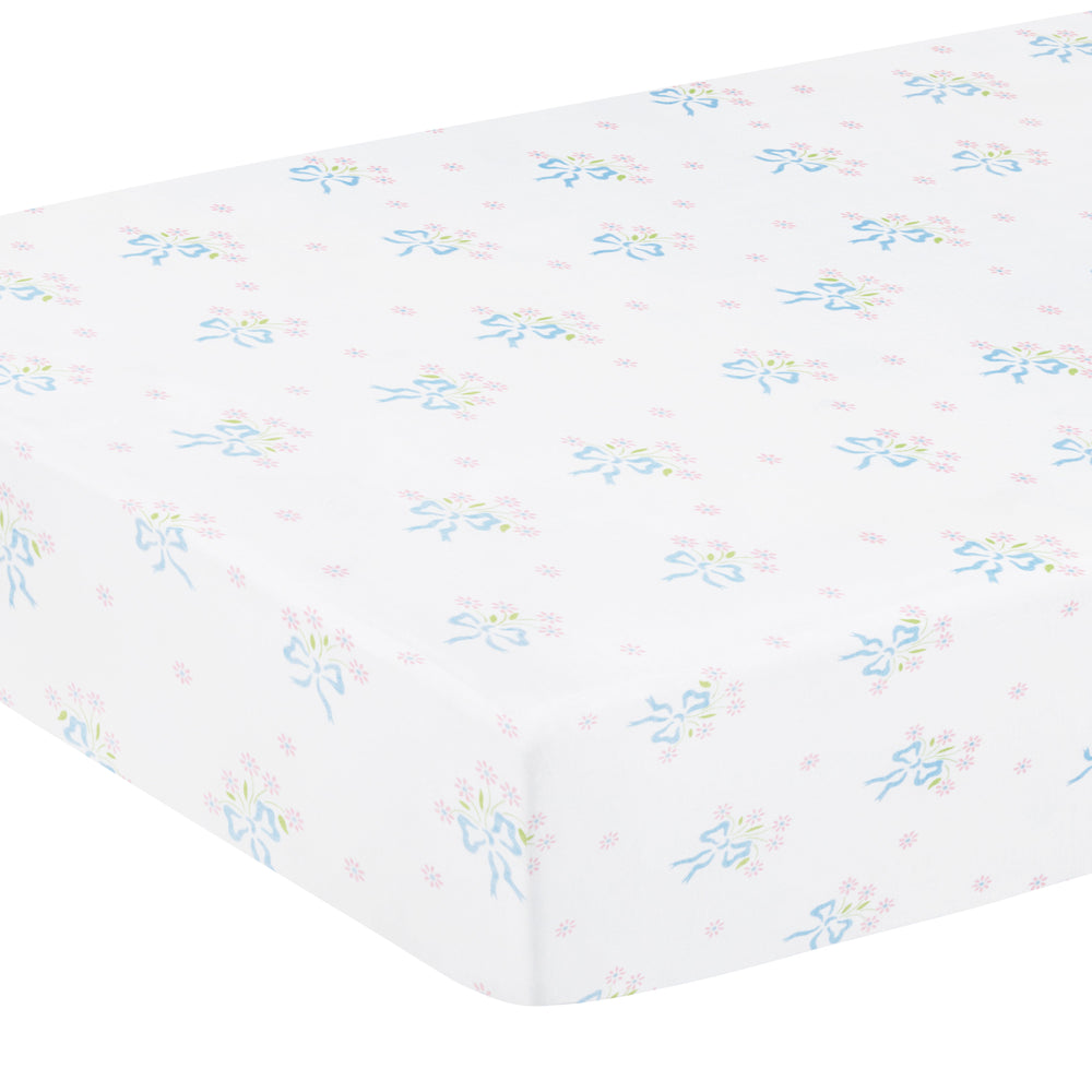 little english classic children's clothing girls pima crib sheet with white background and blue bows with pink floral bouquet all over print 