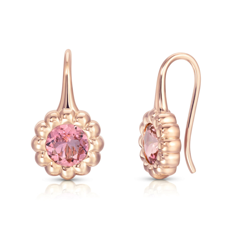 Front and side view of Pink Sapphire Reverie earrings, 14k rose gold with fluted bezel and round pink sapphire on white