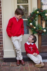 Little English traditional children's clothing. Red Intarsia Sweater with candy cane motif for boys and girls layered over red piped white knit peter pan shirt and khaki pebble twill banded pants. Older boys red quarter zip sweater and red gingham button down shirt and khaki pebble twill classic pants.