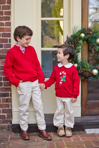 Little English traditional children's clothing. Red Intarsia Sweater with candy cane motif for boys and girls layered over red piped white knit peter pan shirt and khaki pebble twill banded pants. Older boys red quarter zip sweater and red gingham button down shirt and khaki pebble twill classic pants.