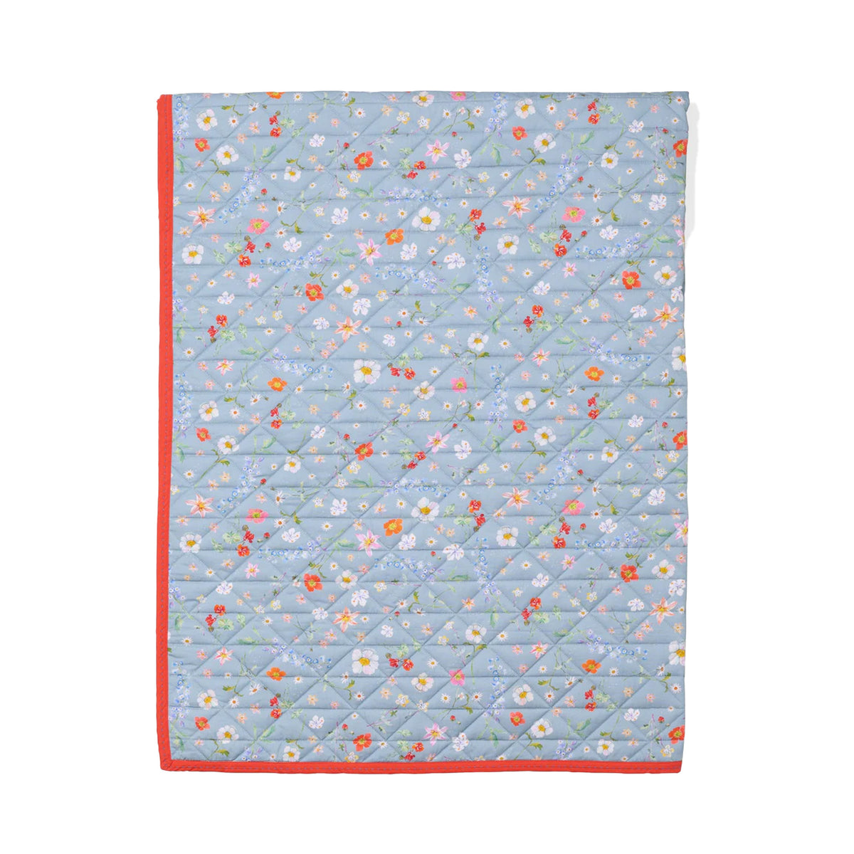 Flat-lay of Play Quilt in Light Floral showing light-blue floral print, coral-red binding, and diamond quilting on white background