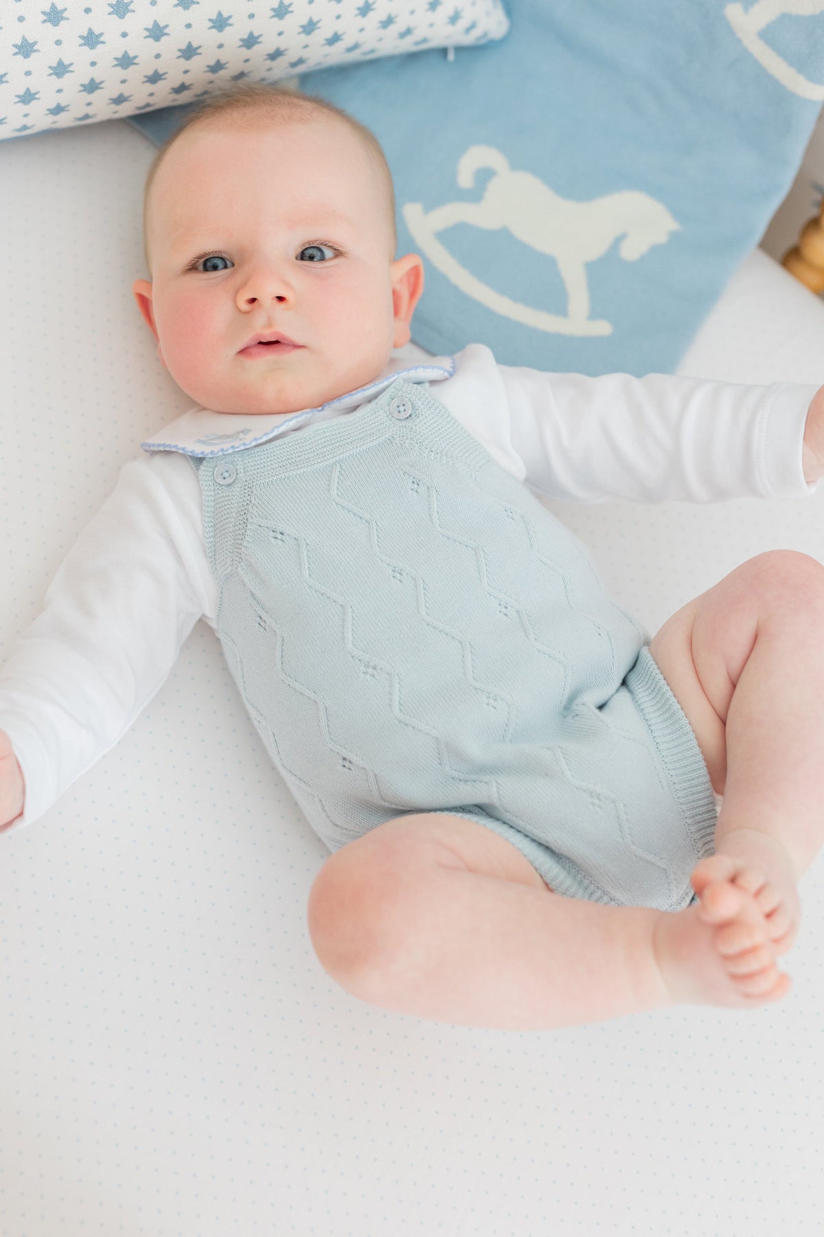 little english classic children's clothing baby boys light blue pointelle knit bubble with pinpoint onesie with rocking horse motif. Pima crib sheet in blue micro dot, for baby boy