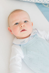 little english classic children's clothing baby boys light blue pointelle knit bubble with pinpoint onesie with rocking horse motif. Pima crib sheet in blue micro dot, for baby boy