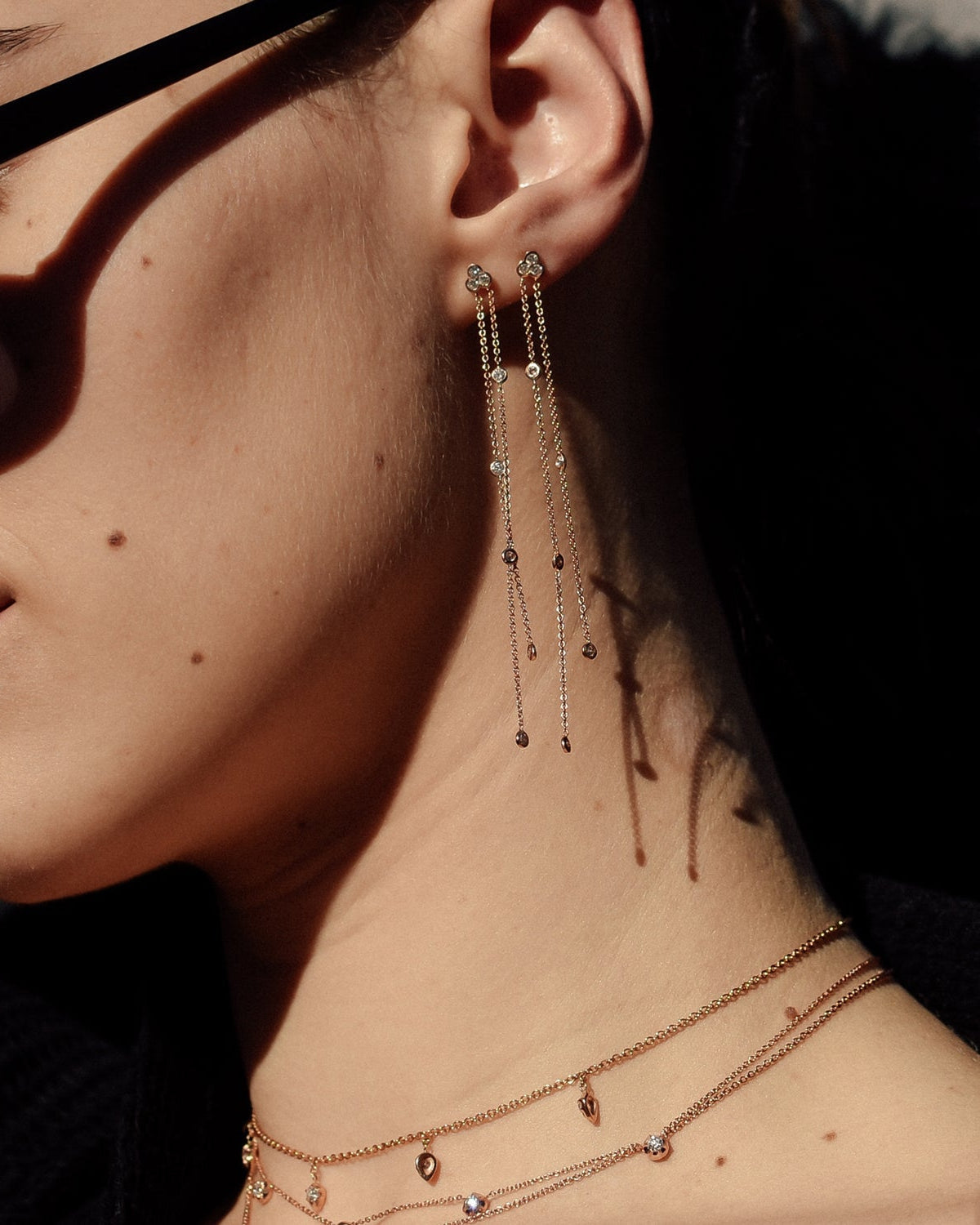 A pair of Poppy Earrings shown stacked on the ear in rose gold. , 14k yellow gold, 14k rose gold, 14k white gold